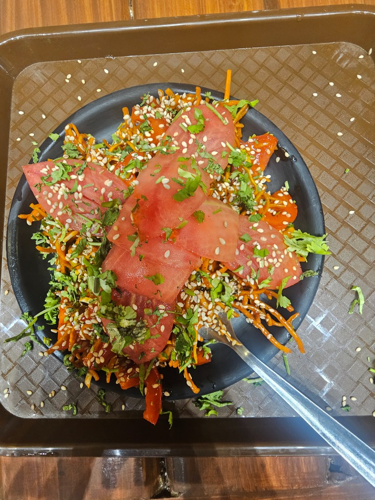 Fresh salad and chaat-style platter at The Street Brews